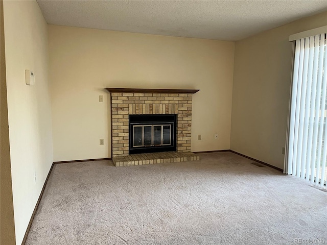 17969 E Brown Pl, Aurora, CO 80013 - unfurnished living room featuring carpet flooring, a textured ceiling, a fireplace, and baseboards
