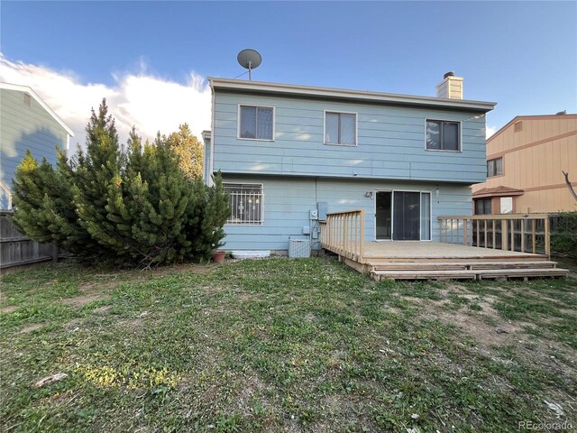 17969 E Brown Pl, Aurora, CO 80013 - rear view of house featuring a chimney, a deck, and cooling unit