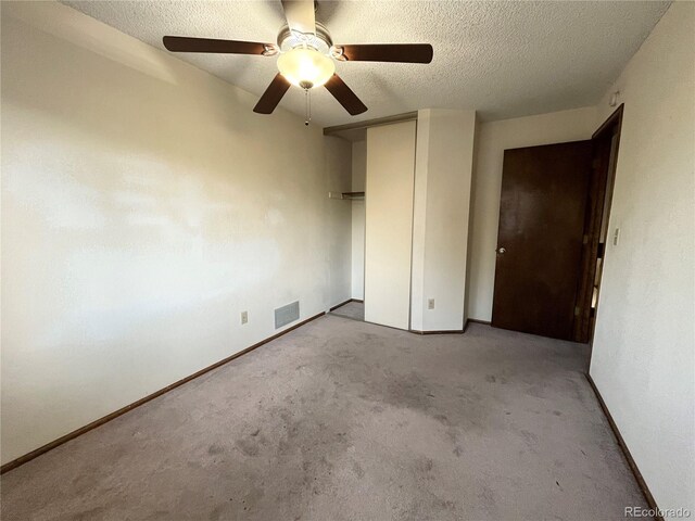 17969 E Brown Pl, Aurora, CO 80013 - unfurnished bedroom with a textured ceiling, carpet, a closet, ceiling fan, and baseboards