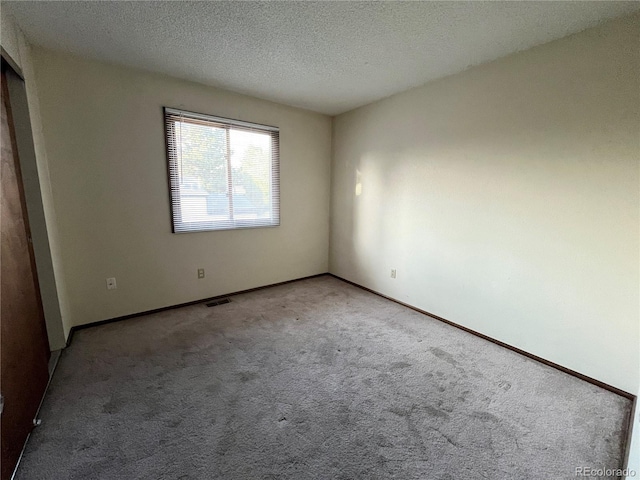 17969 E Brown Pl, Aurora, CO 80013 - unfurnished bedroom with carpet flooring, a textured ceiling, and baseboards