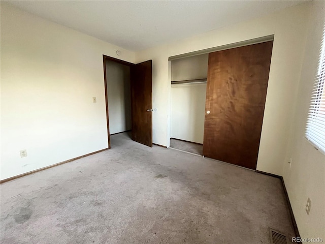 17969 E Brown Pl, Aurora, CO 80013 - unfurnished bedroom with light colored carpet, baseboards, and a closet