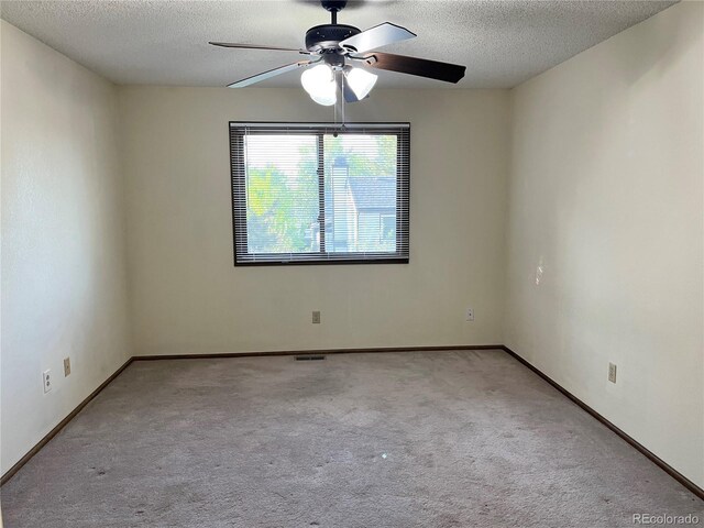 17969 E Brown Pl, Aurora, CO 80013 - spare room with a ceiling fan, carpet, a textured ceiling, and baseboards