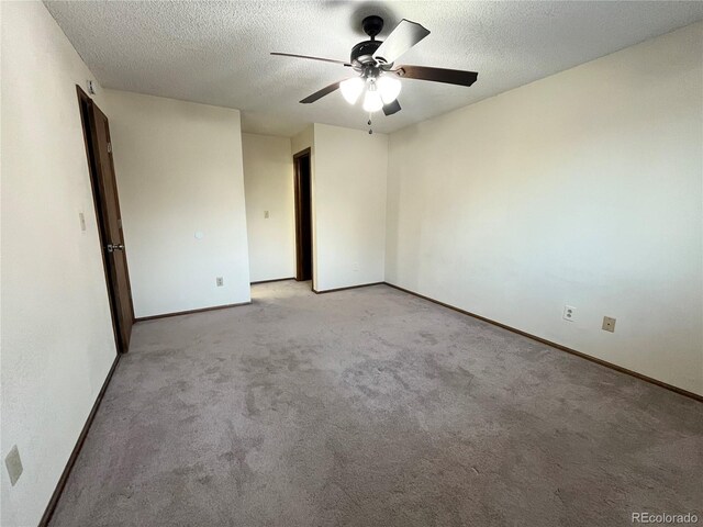 17969 E Brown Pl, Aurora, CO 80013 - spare room with a ceiling fan, a textured ceiling, baseboards, and light colored carpet