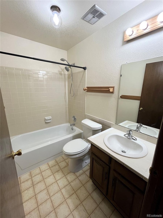 17969 E Brown Pl, Aurora, CO 80013 - bathroom with shower / bath combination, vanity, toilet, a textured ceiling, and a textured wall