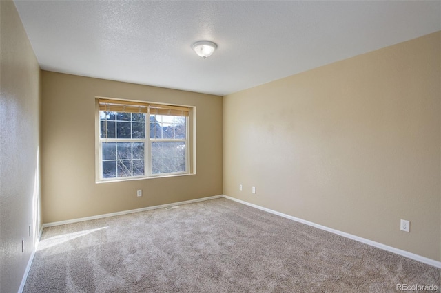 unfurnished room with carpet floors