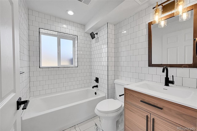 full bathroom with toilet, tile walls, vanity, tiled shower / bath combo, and decorative backsplash