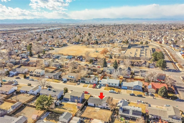 birds eye view of property featuring a mountain view