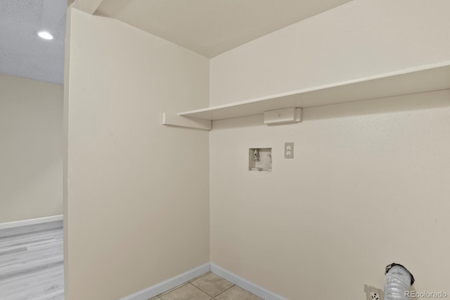 laundry room featuring washer hookup, baseboards, recessed lighting, and light tile patterned floors