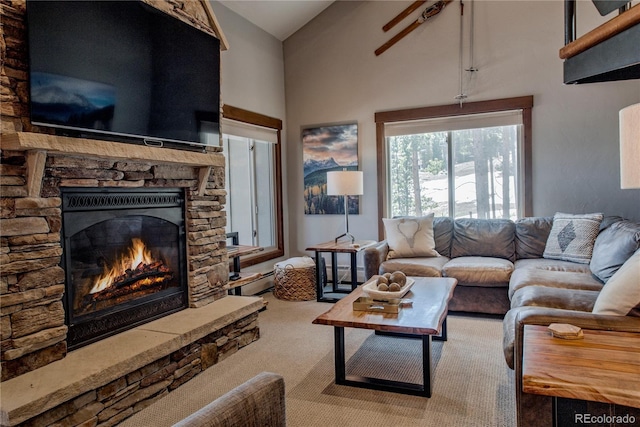 107 Ski Watch Rd Unit 32, Breckenridge, CO 80424 - carpeted living area featuring a fireplace and high vaulted ceiling