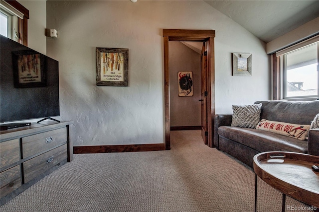 107 Ski Watch Rd Unit 32, Breckenridge, CO 80424 - carpeted living area with vaulted ceiling and baseboards