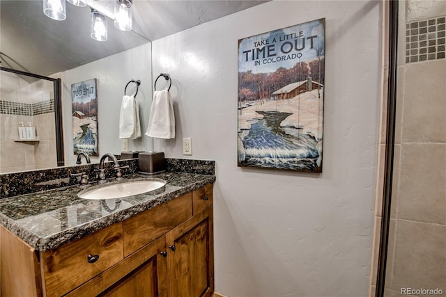 107 Ski Watch Rd Unit 32, Breckenridge, CO 80424 - bathroom with vanity and an enclosed shower