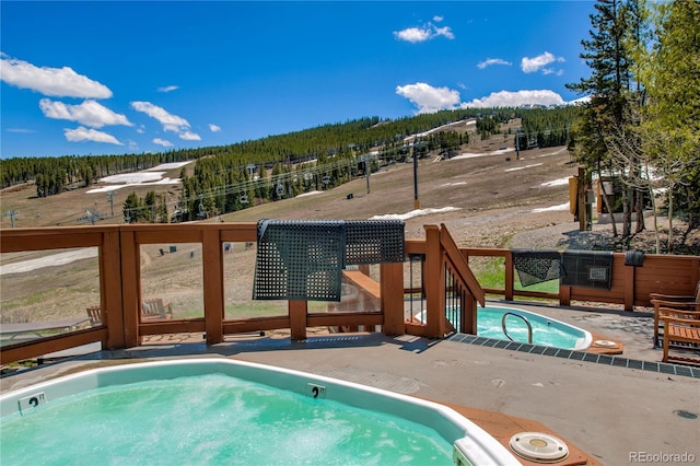 107 Ski Watch Rd Unit 32, Breckenridge, CO 80424 - view of swimming pool with a forest view