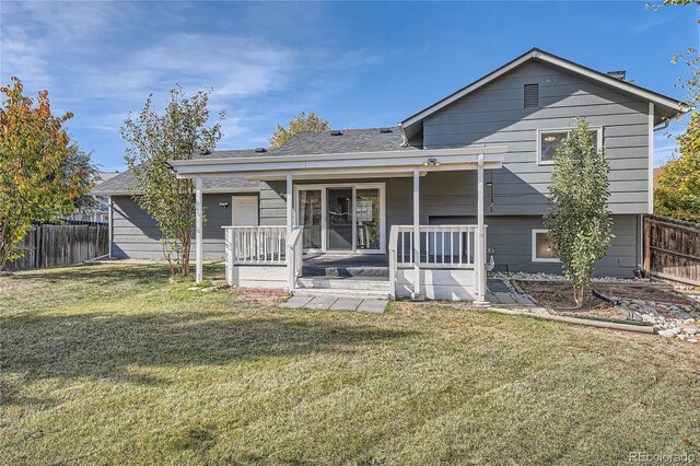 view of front of home with covered porch and a front yard