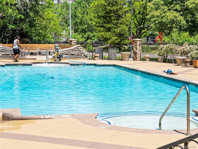 1301 Speer Blvd Unit 702, Denver, CO 80204 - community pool with view of scattered trees and a patio area