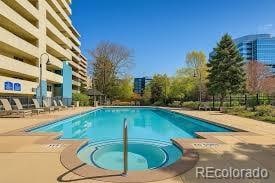 1301 Speer Blvd Unit 702, Denver, CO 80204 - community pool featuring a patio and a hot tub