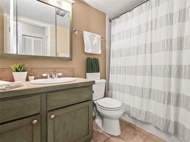 1301 Speer Blvd Unit 702, Denver, CO 80204 - full bathroom featuring toilet, vanity, tile patterned floors, and curtained shower