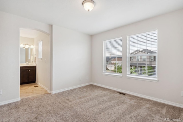 1191 Solitaire St, Colorado Springs, CO 80905 - unfurnished room with light carpet and arched walkways