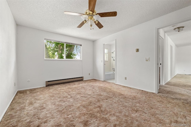 11199 Dahlia Pl, Thornton, CO 80233 - carpeted spare room featuring a baseboard heating unit, a textured ceiling, a ceiling fan, and baseboards