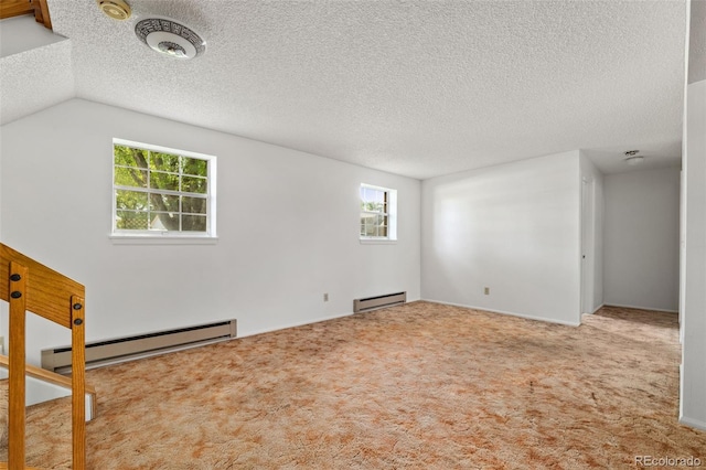 11199 Dahlia Pl, Thornton, CO 80233 - carpeted spare room featuring a baseboard heating unit and a textured ceiling
