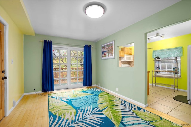 2627 Champa St, Denver, CO 80205 - bedroom with baseboards and wood finished floors