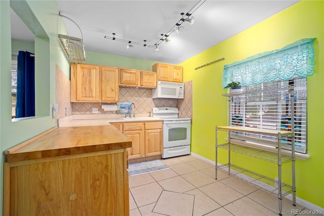 2627 Champa St, Denver, CO 80205 - kitchen with white appliances, light brown cabinets, tasteful backsplash, and light tile patterned floors