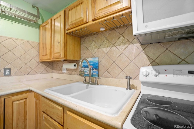 2627 Champa St, Denver, CO 80205 - kitchen featuring white electric range oven and backsplash