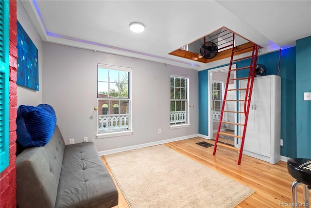 2627 Champa St, Denver, CO 80205 - living area featuring wood finished floors and a tray ceiling