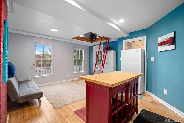 2627 Champa St, Denver, CO 80205 - kitchen featuring freestanding refrigerator, butcher block counters, light wood-style flooring, recessed lighting, and open floor plan
