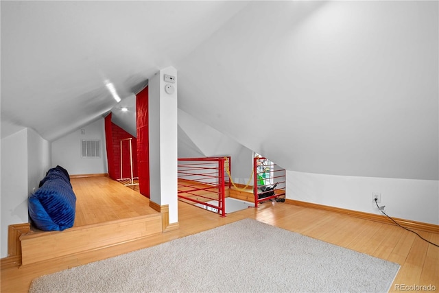 2627 Champa St, Denver, CO 80205 - bonus room featuring wood finished floors and lofted ceiling