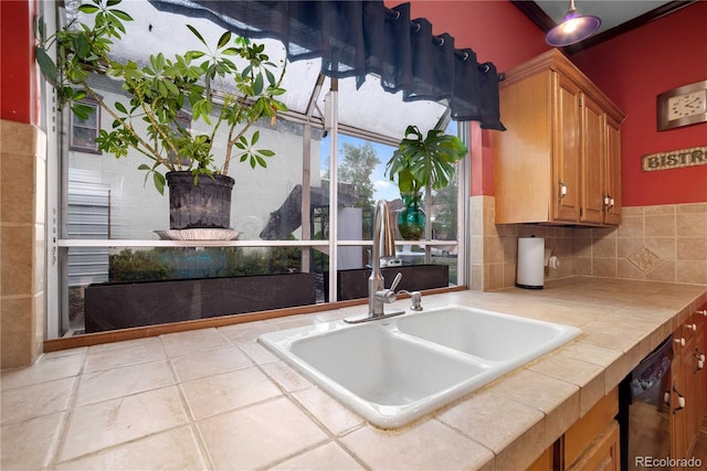 2627 Champa St, Denver, CO 80205 - kitchen featuring tile countertops, brown cabinets, and dishwasher