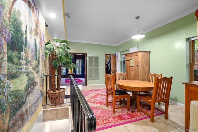 2627 Champa St, Denver, CO 80205 - dining area featuring light tile patterned floors and crown molding