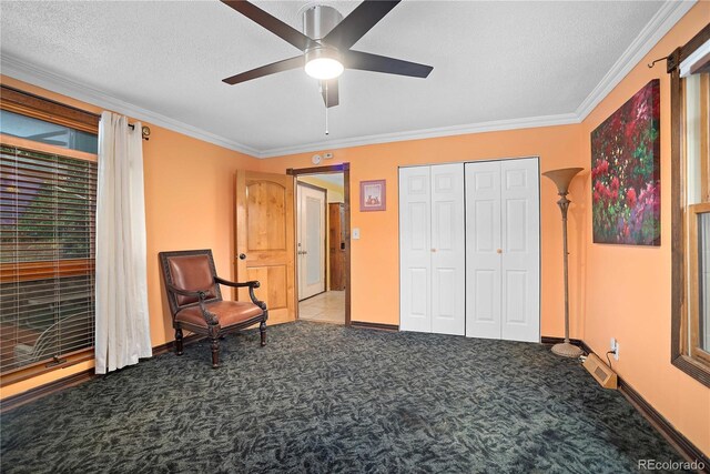 2627 Champa St, Denver, CO 80205 - sitting room with carpet floors, ornamental molding, a ceiling fan, and a textured ceiling