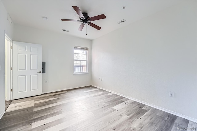 unfurnished room featuring ceiling fan and light wood-type flooring