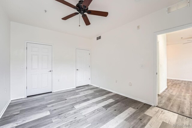 interior space featuring ceiling fan and light wood-type flooring