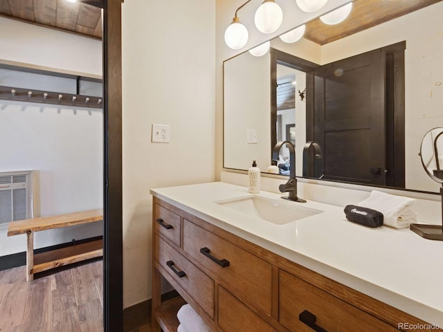 bathroom featuring hardwood / wood-style flooring and vanity