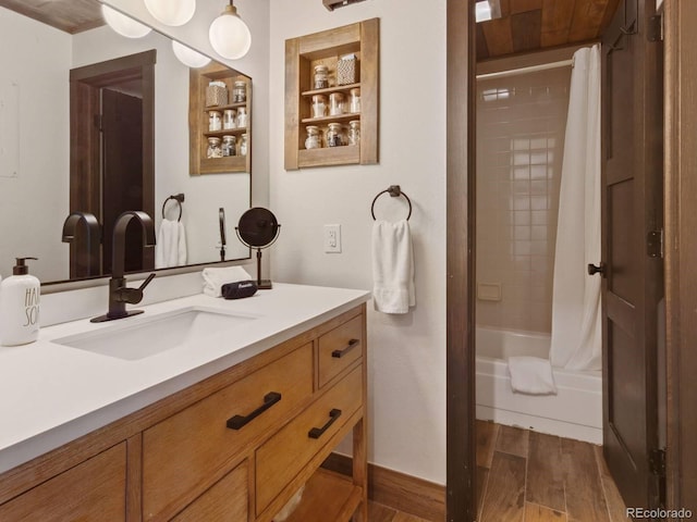 bathroom featuring built in shelves, vanity, and shower / bath combo with shower curtain