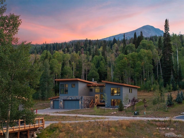 exterior space featuring a mountain view and a garage