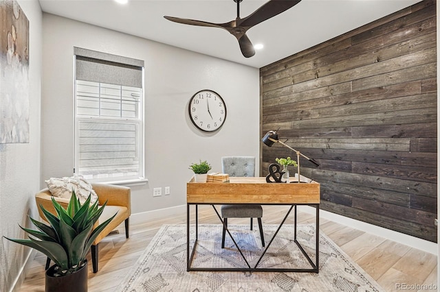office space with recessed lighting, ceiling fan, wood walls, and baseboards