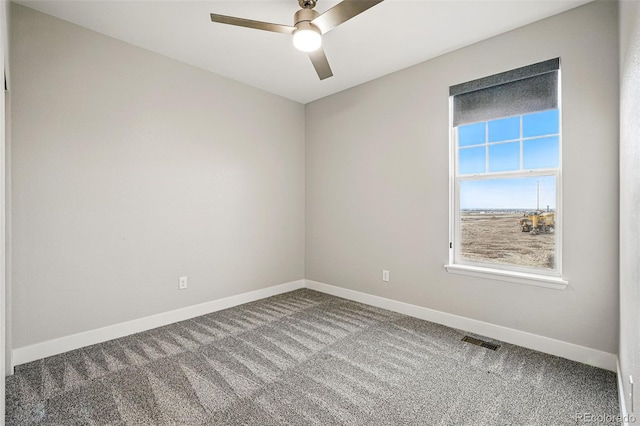 unfurnished room featuring baseboards, ceiling fan, carpet floors, and visible vents