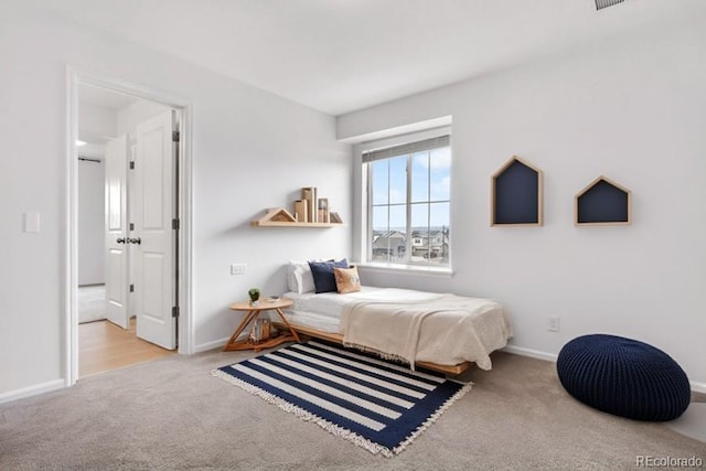 bedroom with light carpet