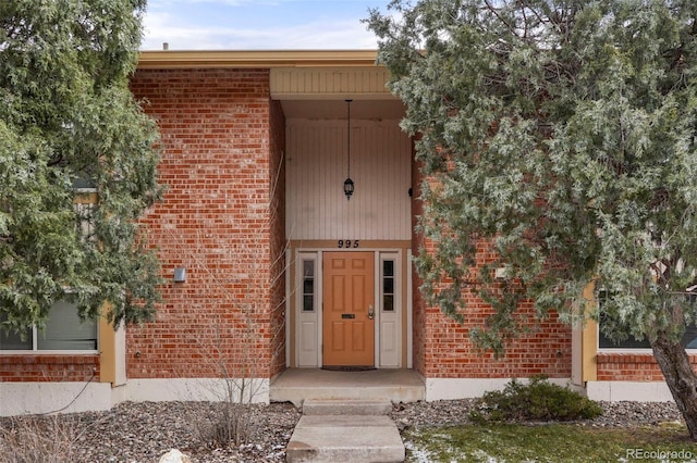 995 Holli Springs Ln, Colorado Springs, CO 80907 - view of exterior entry featuring brick siding