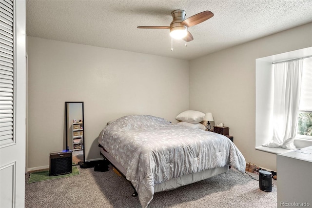 995 Holli Springs Ln, Colorado Springs, CO 80907 - carpeted bedroom with a textured ceiling and a ceiling fan
