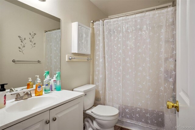 995 Holli Springs Ln, Colorado Springs, CO 80907 - full bath featuring toilet, vanity, and a shower with shower curtain
