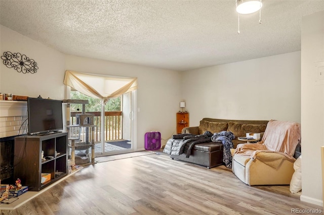 995 Holli Springs Ln, Colorado Springs, CO 80907 - living room featuring wood finished floors and a textured ceiling