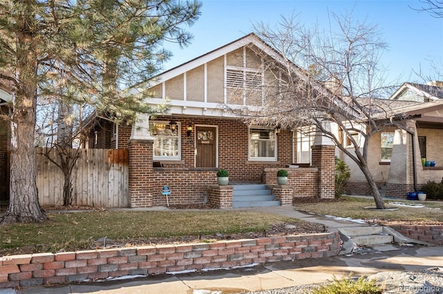 english style home with a front yard