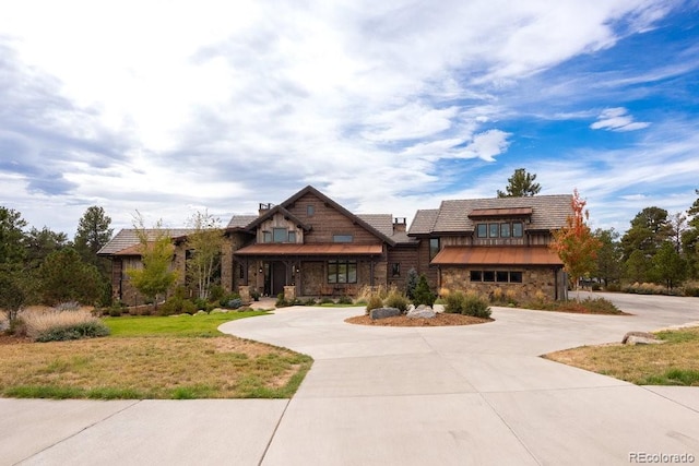 craftsman house with a front yard