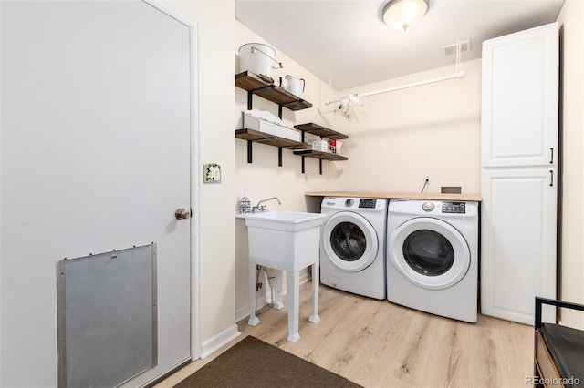 2480 W Jamison Way, Littleton, CO 80120 - laundry room featuring washer and clothes dryer and light wood finished floors