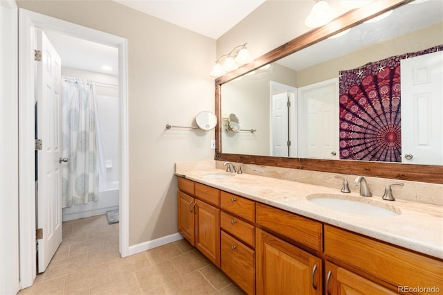 2480 W Jamison Way, Littleton, CO 80120 - full bath with double vanity, tile patterned floors, and shower / bath combo