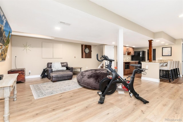 2480 W Jamison Way, Littleton, CO 80120 - exercise room with light wood-style floors, recessed lighting, and decorative columns