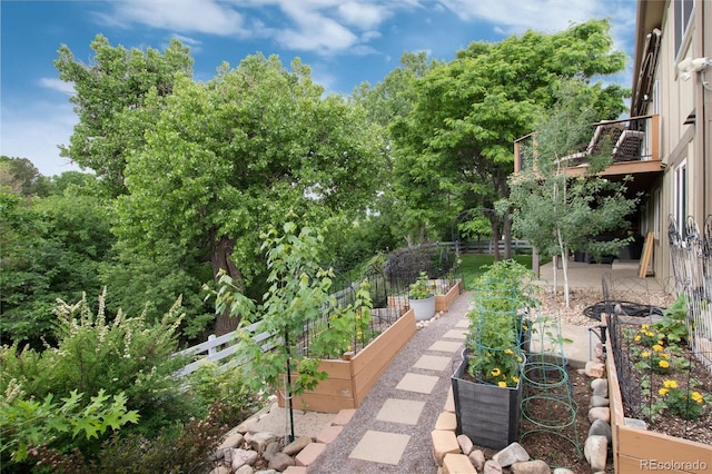 2480 W Jamison Way, Littleton, CO 80120 - view of yard featuring a garden and a balcony